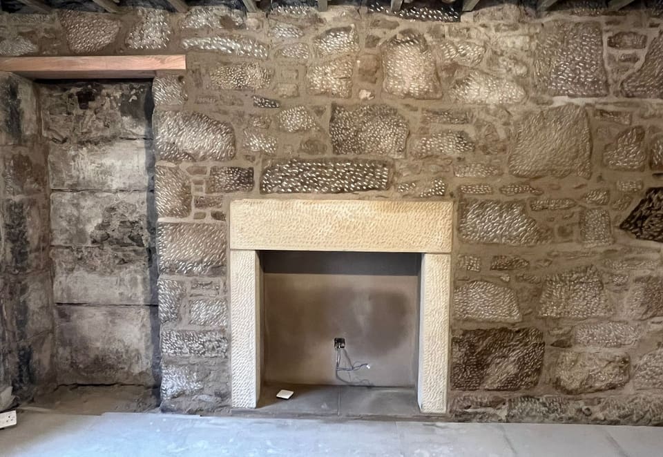 Stone Fireplace and Exposed Wall - after